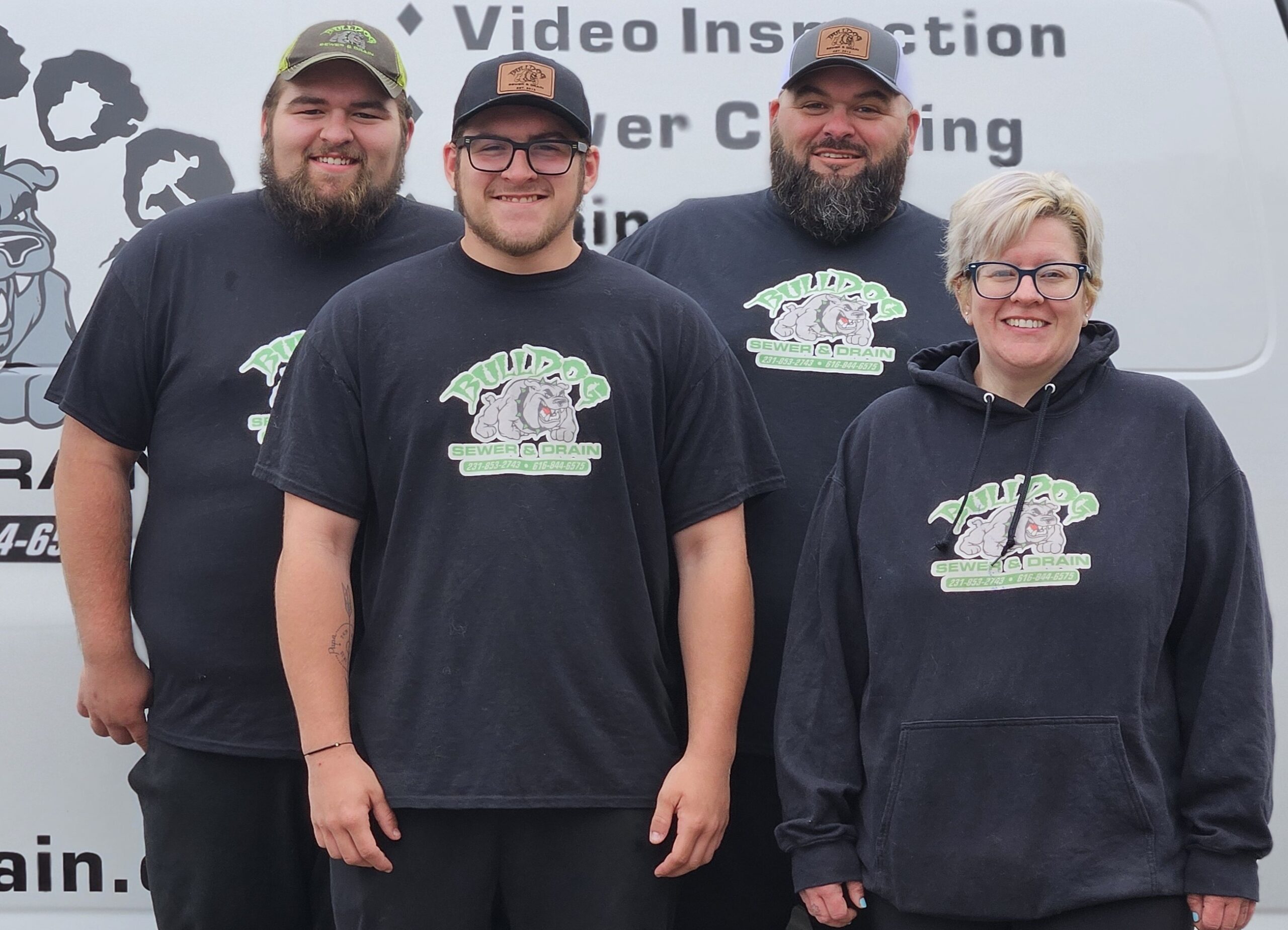 The Bulldog Sewer & Drain team in front of a company service van
