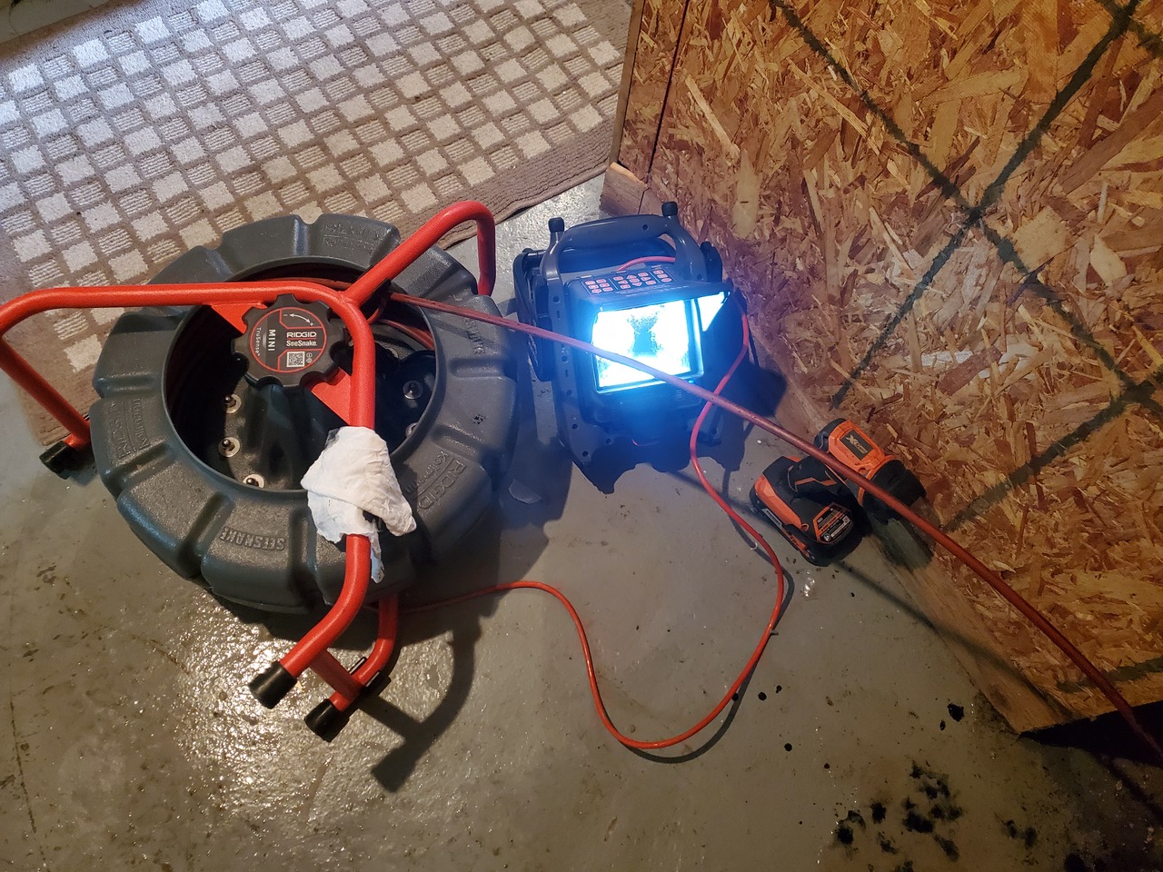Sewer camera inspection equipment in a basement